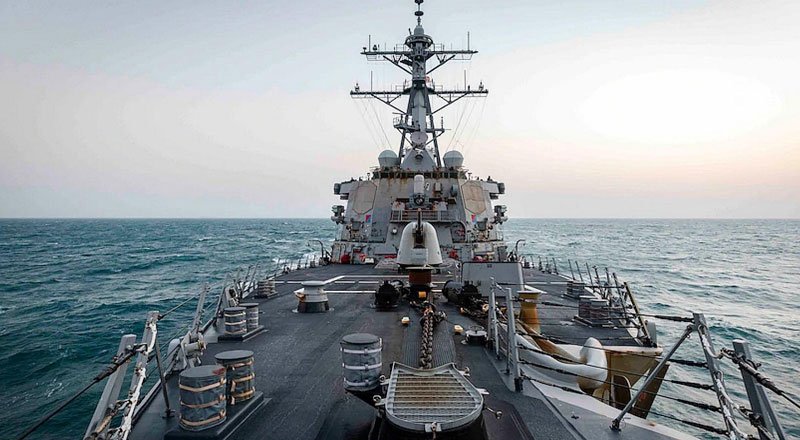 China hits out as one of American warships sails past a reef on South China Sea